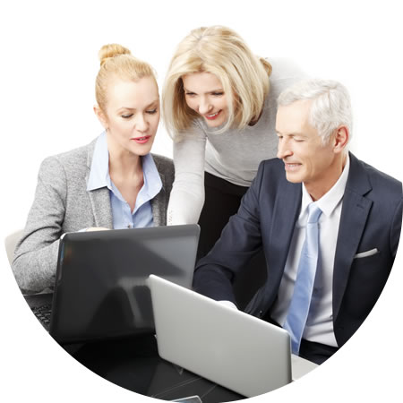 Two Women and a Man Looking at Monitors