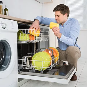 Man Loading Dishes