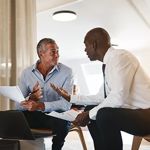 Two Men Sitting and Talking