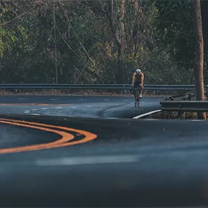 Cyclist Climbing a Hill