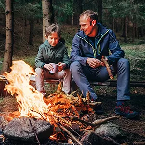 Father and Son at a Campfire