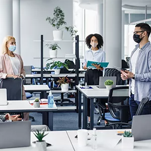 Masked Employees in an Office