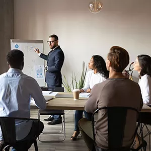 A Man Presenting to a Group