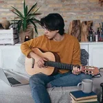 Teenager Playing the Guitar