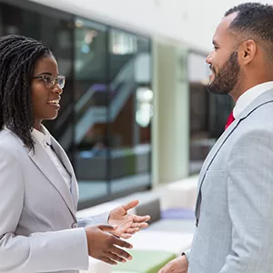 Happy conversation between two business professionals