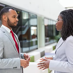 Serious conversation between two business professionals