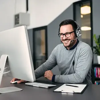 Man with headset on the computer